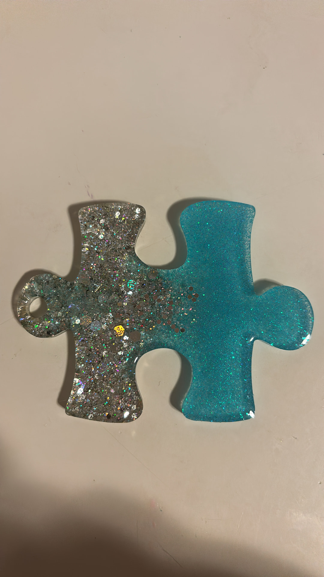Teal puzzle-piece coaster